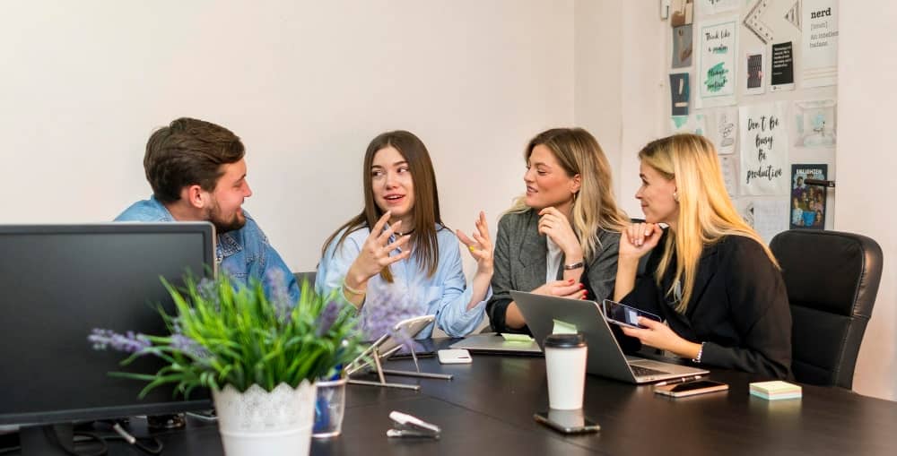 Colleagues using effective communication within workplace